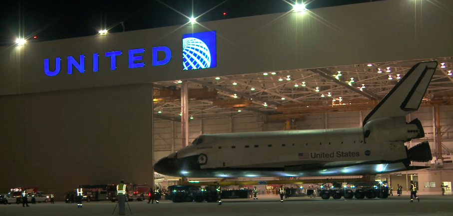 Endeavour on the self-propelled modular transporter leaving LAX.