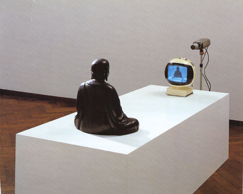 Nam June Paik, TV Buddha (1974) Closed Circuit video installation with bronze sculpture
